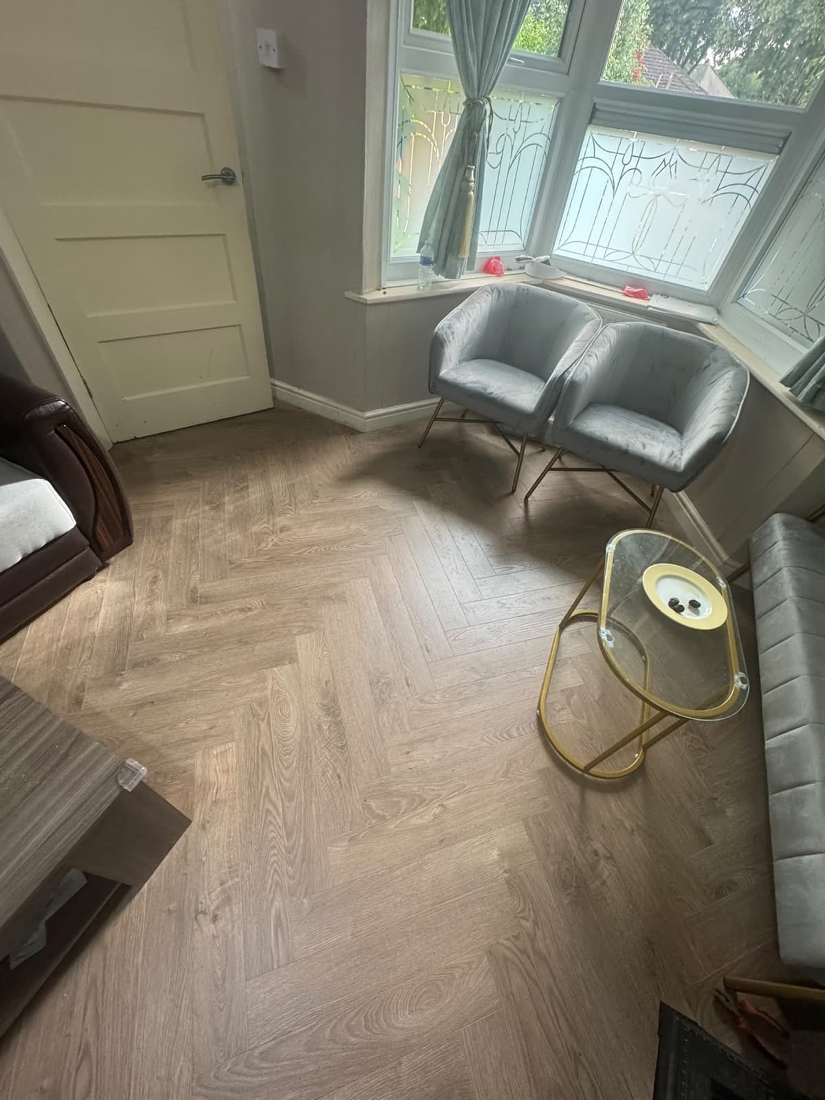 Herringbone wood-effect laminate flooring in a Birmingham living room