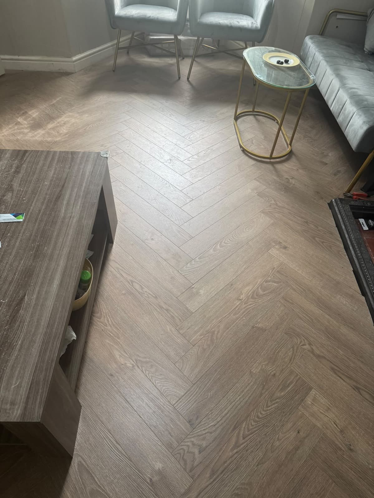 Finished herringbone laminate flooring by CH Developments in Birmingham